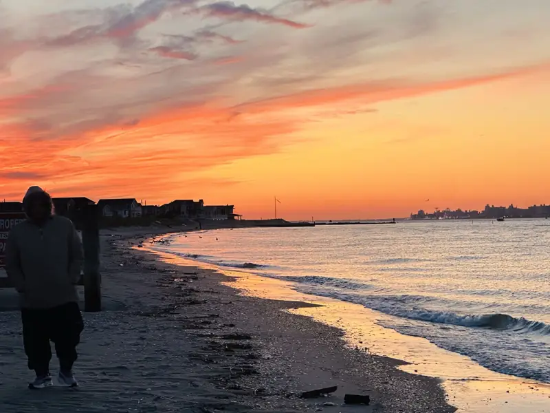 Sunset over the water with the city skyline