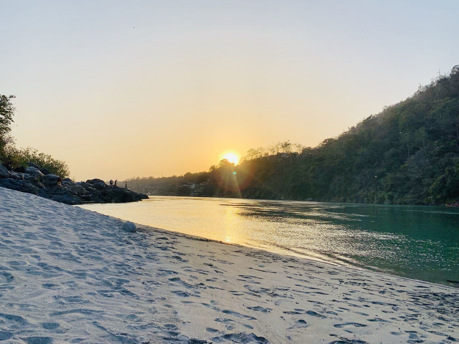 Arms wide open at sunrise high above the Ganga valley