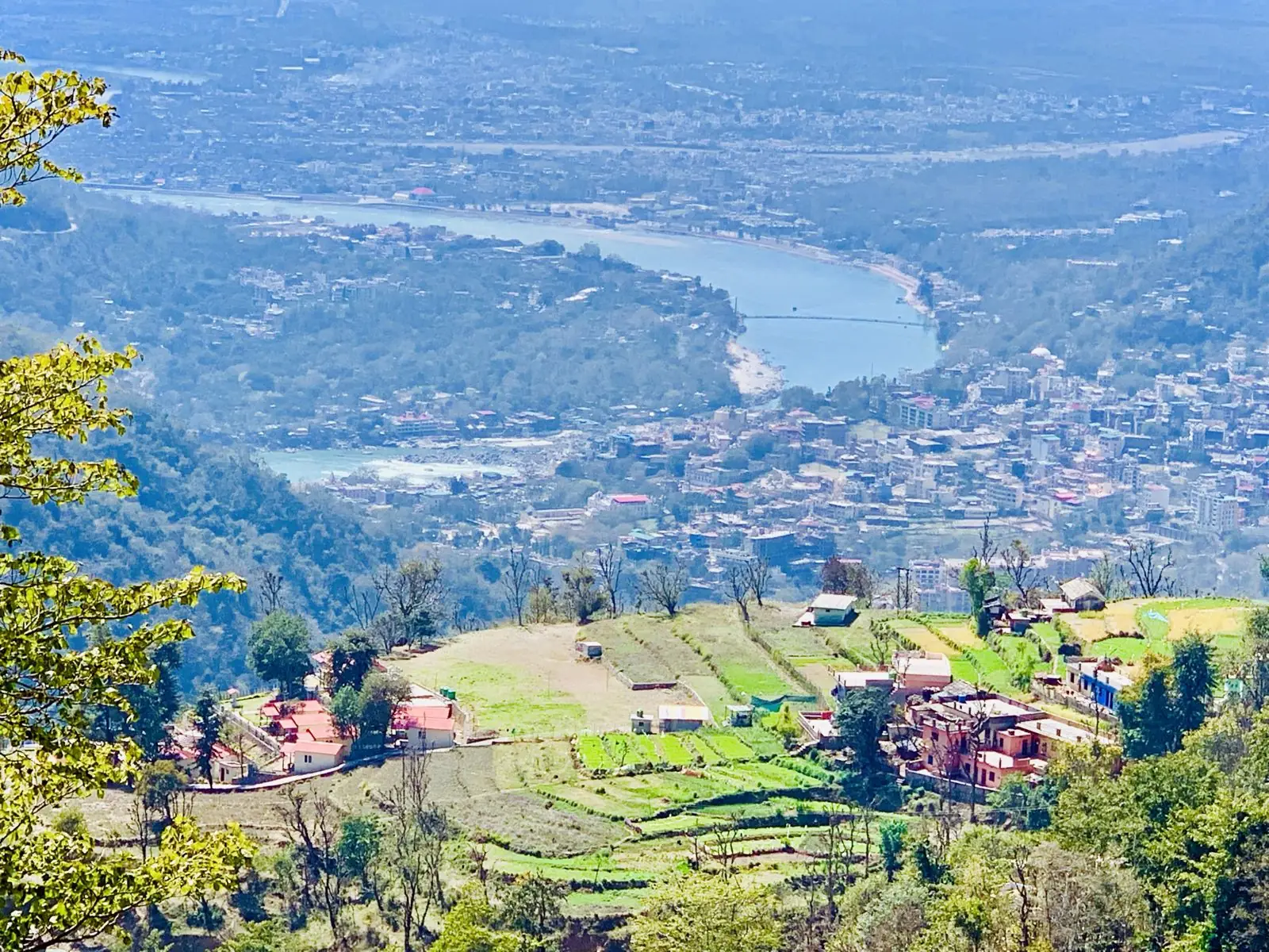 The turquoise Ganga between forested mountains