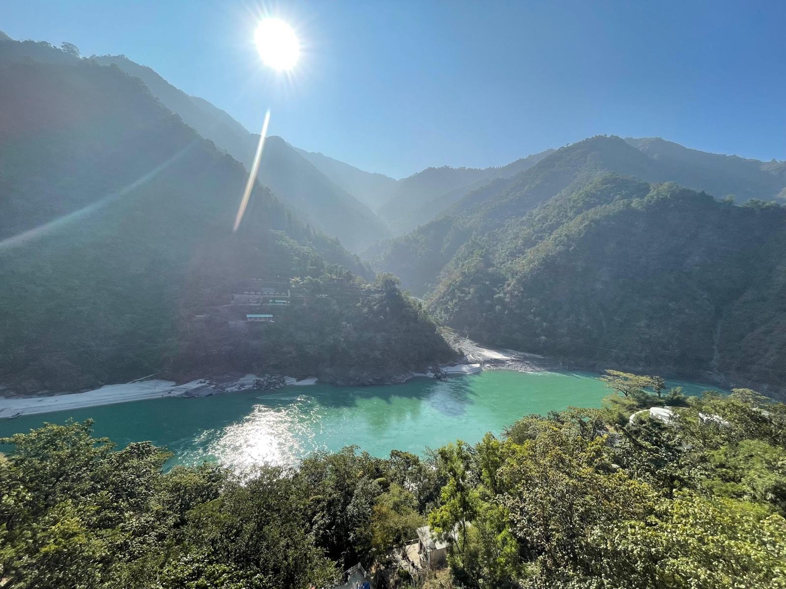 The turquoise Ganga winding between forested mountains above Rishikesh