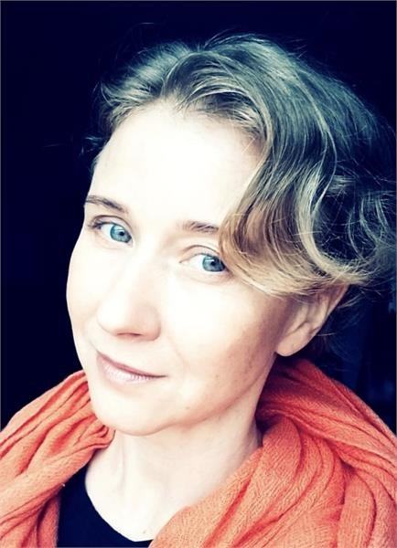 Olga Chuglazov portrait in an orange scarf